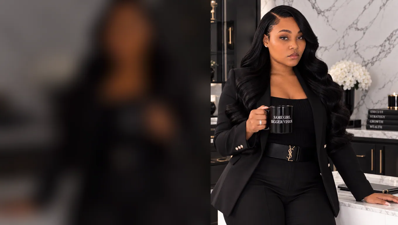 Aysia Fields standing at the office counter with a coffee mug.